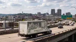Birmingham Moving Company truck driving on highway in Birmingham, Alabama.