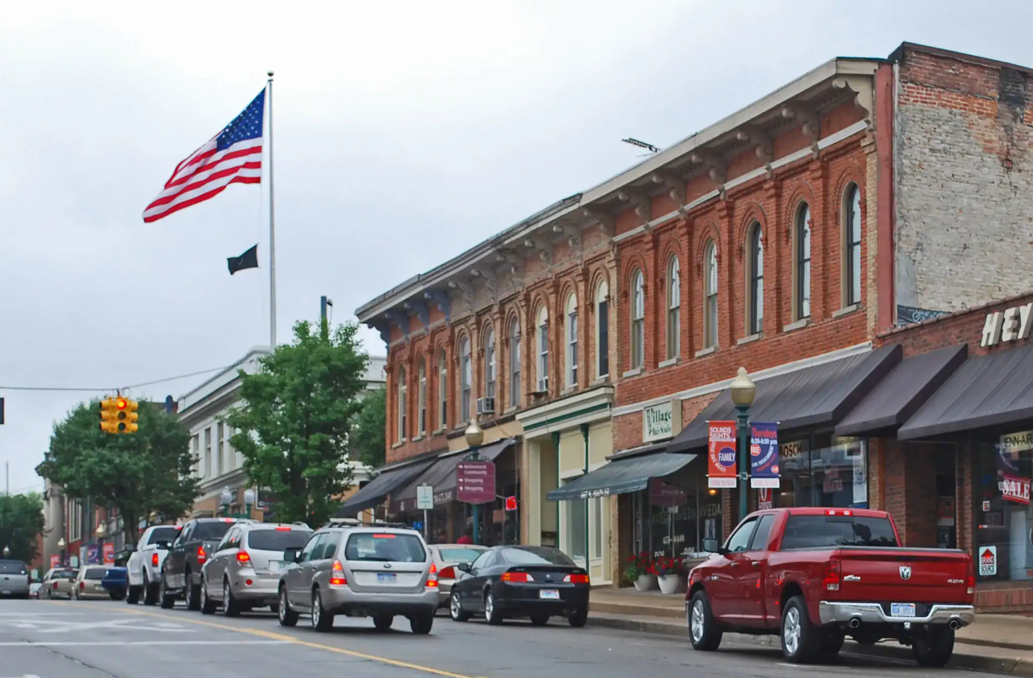 Brick storefronts and American flag in Chelsea, Alabama