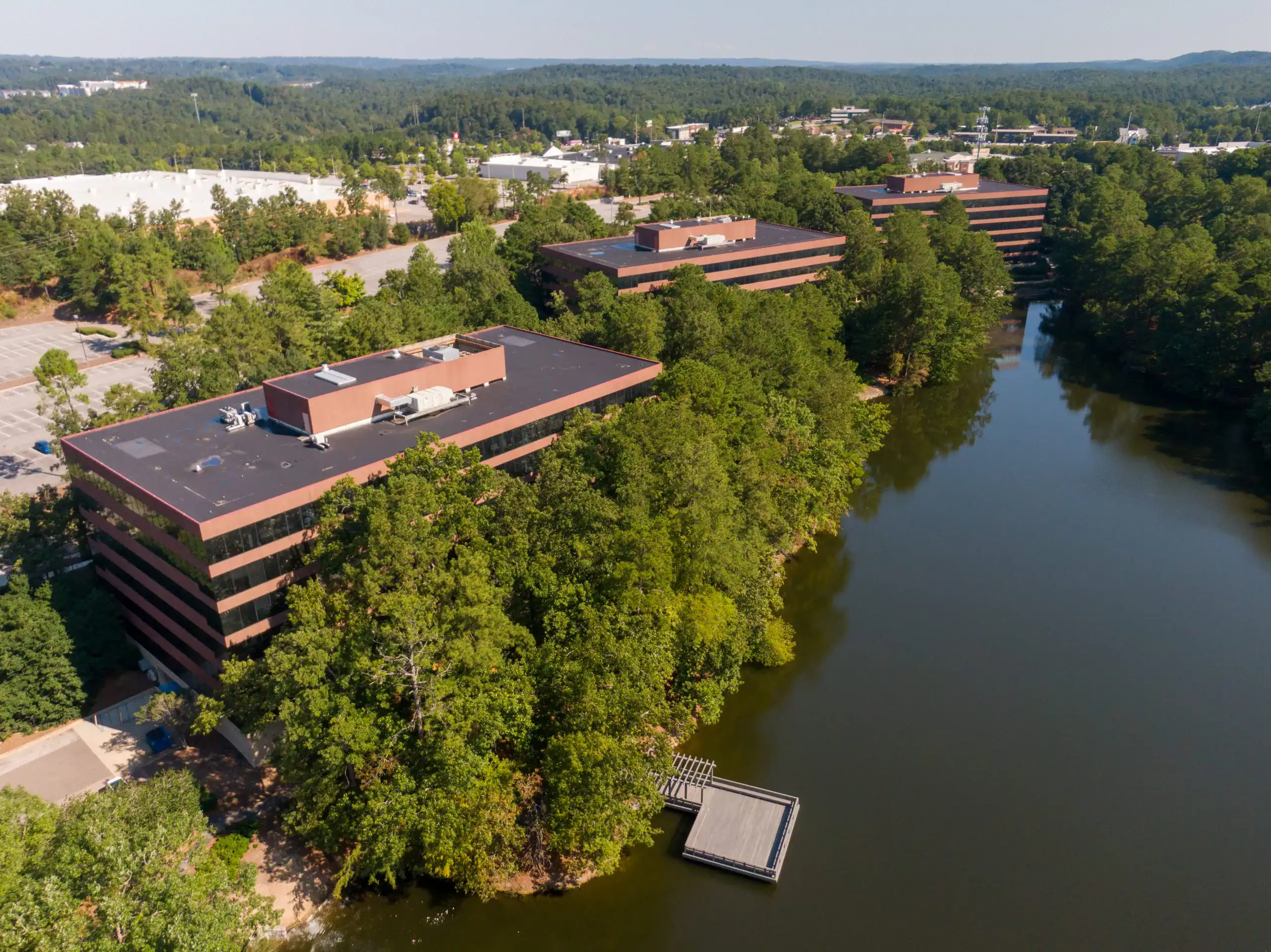 Aerial view of office buildings beside the water in Inverness, Alabama