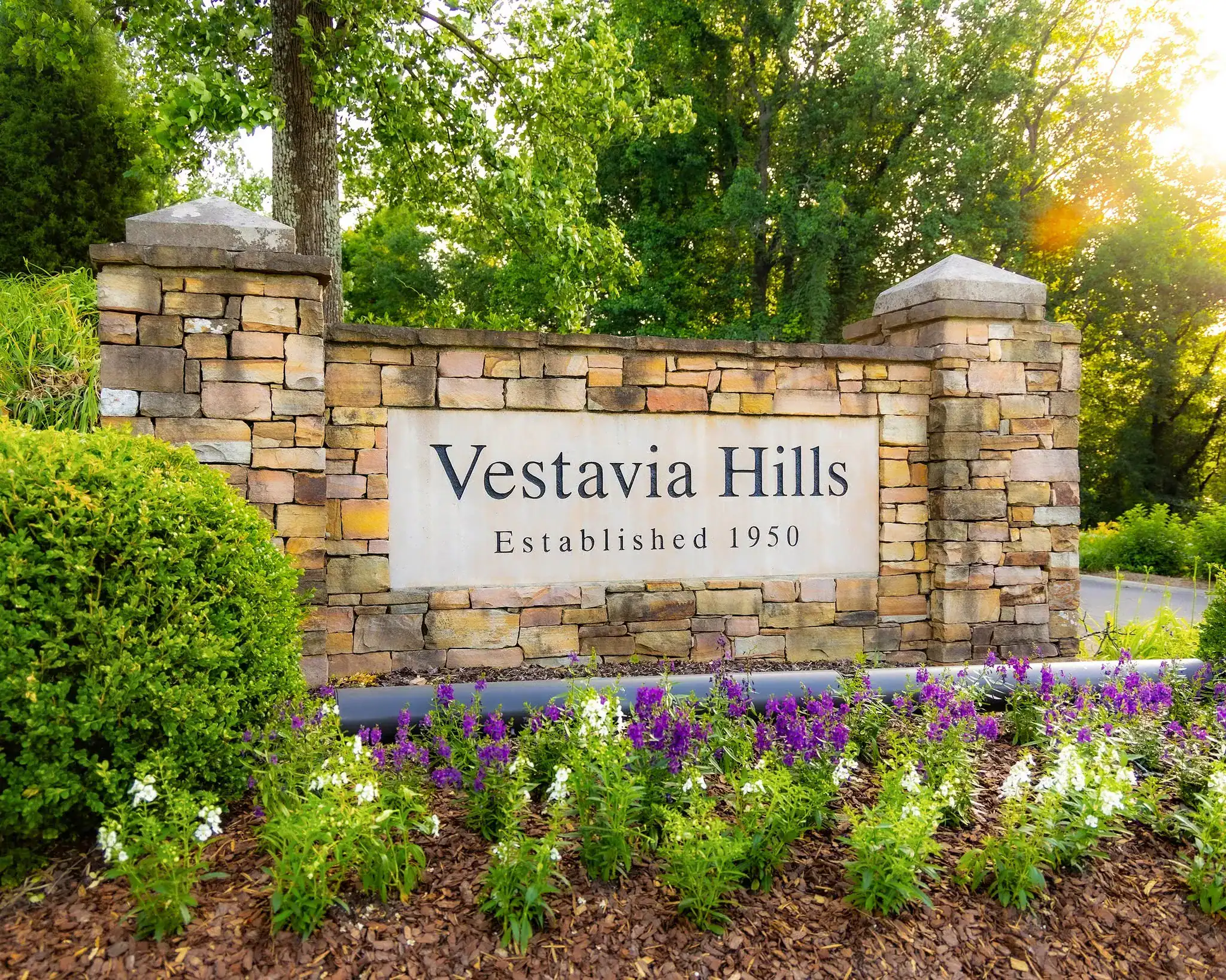 Vestavia Hills city sign surrounded by flowers